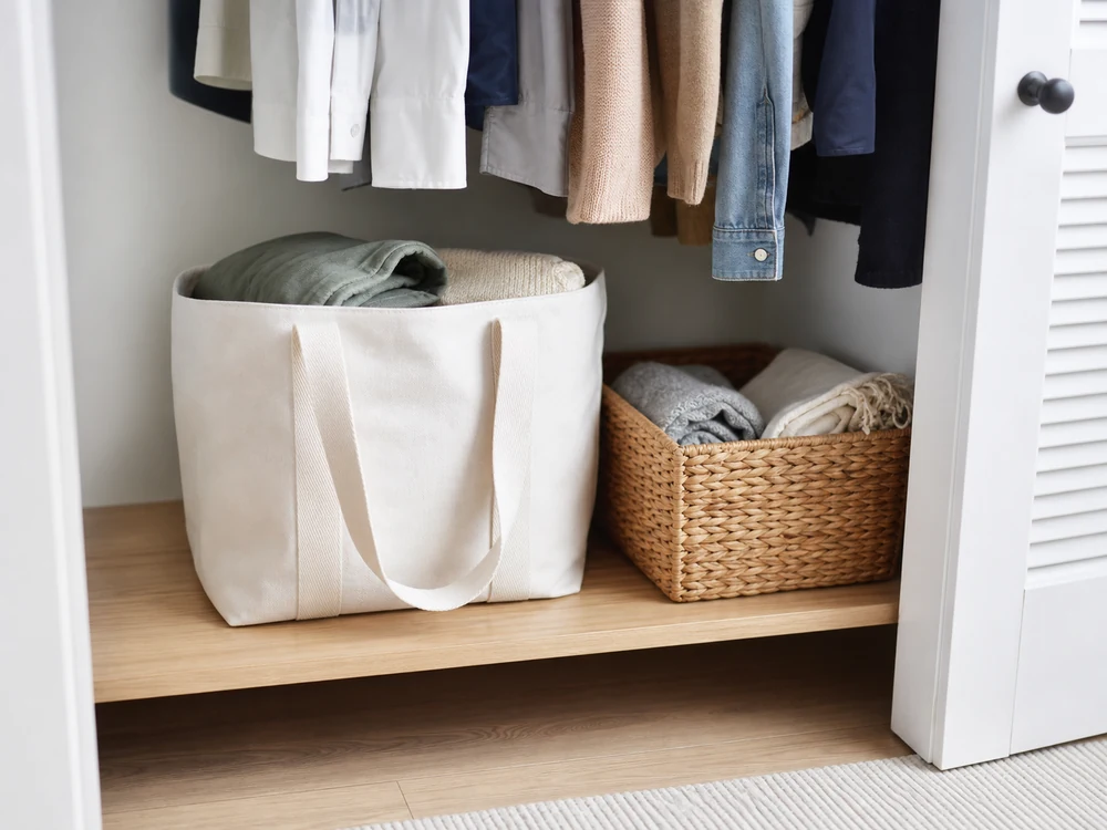 small apartment donation station ideas showing handled donation bag shelf