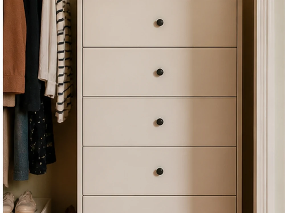 Compact bedroom closet overflow managed with a slim dresser and fabric bins above